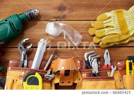 different work tools on wooden boards different work tools on wooden boards 66865425