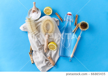 vinegar, lemons, soda, clothespins and brushes vinegar, lemons, soda, clothespins and brushes 66865435