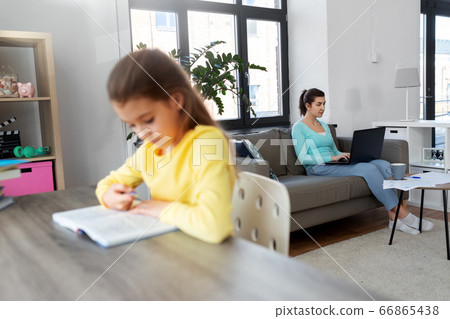 mother working and daughter studying at home mother working and daughter studying at home 66865438