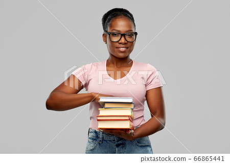 happy african american woman with books happy african american woman with books 66865441
