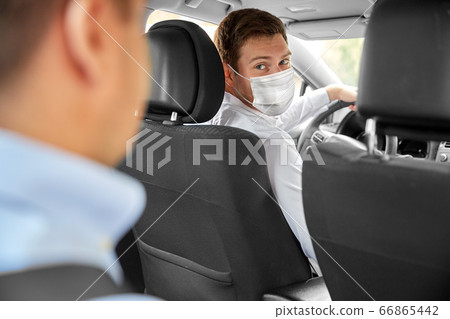 taxi driver in face protective mask driving car taxi driver in face protective mask driving car 66865442