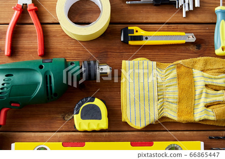 different work tools on wooden boards different work tools on wooden boards 66865447