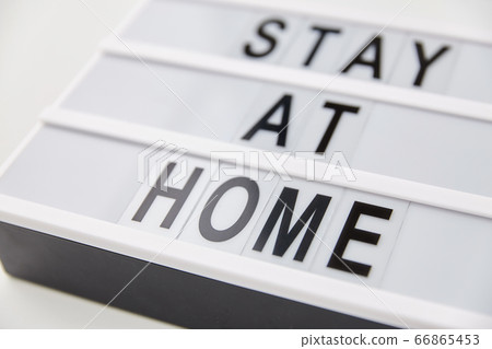 lightbox with stay at home caution words lightbox with stay at home caution words 66865453