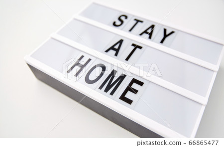 lightbox with stay at home caution words lightbox with stay at home caution words 66865477