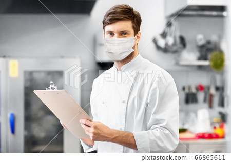 chef with clipboard in face mask at restaurant chef with clipboard in face mask at restaurant 66865611