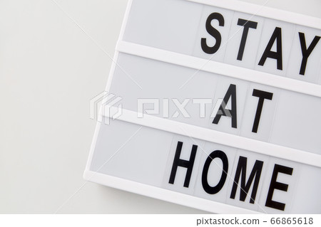 lightbox with stay at home caution words lightbox with stay at home caution words 66865618