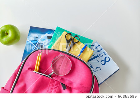 backpack with books, school supplies and apple backpack with books, school supplies and apple 66865689