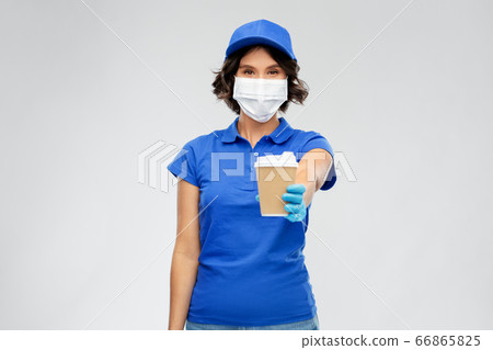 saleswoman in face mask with takeaway coffee cup saleswoman in face mask with takeaway coffee cup 66865825