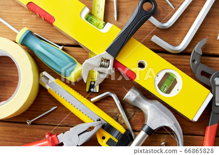 different work tools on wooden boards background different work tools on wooden boards background 66865828