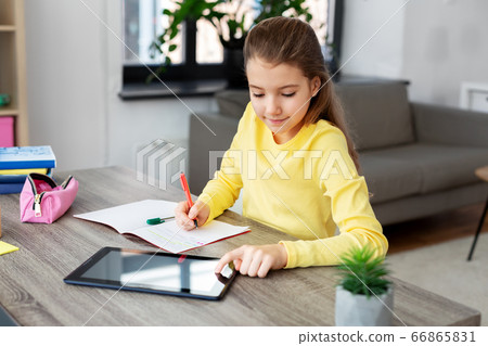 student girl with tablet pc notebook at home student girl with tablet pc notebook at home 66865831