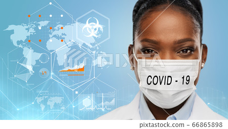 doctor in medical mask over world pandemia map 66865898