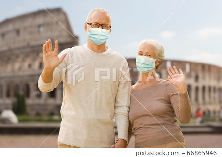 senior couple in protective medical masks in italy senior couple in protective medical masks in italy 66865946