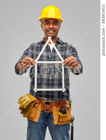 happy indian builder with ruler in shape of home happy indian builder with ruler in shape of home 66865953