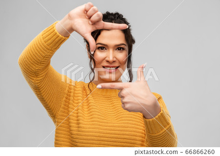 happy young woman making frame with her fingers happy young woman making frame with her fingers 66866260