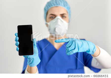 doctor in goggles and face mask with smartphone doctor in goggles and face mask with smartphone 66866431