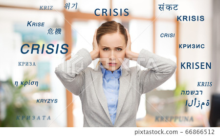 stressed businesswoman with covered ears in crisis 66866512