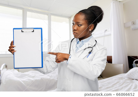 african american doctor with clipboard at hospital 66866652