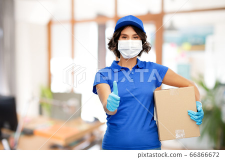 delivery woman in mask with parcel box at office delivery woman in mask with parcel box at office 66866672