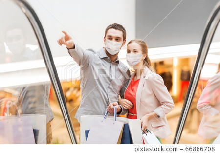 happy young couple with shopping bags in mall happy young couple with shopping bags in mall 66866708