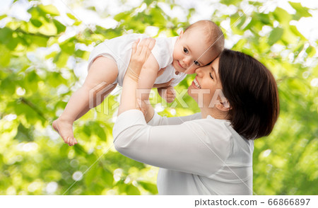 happy middle-aged mother with little baby daughter happy middle-aged mother with little baby daughter 66866897