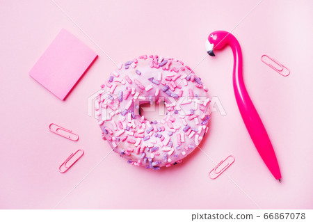 Pink doughnut and Flamingo pen on a pink background. Top view Flat lay. 66867078