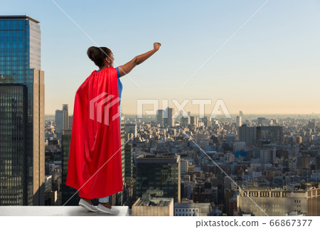 happy african american woman in red superhero cape happy african american woman in red superhero cape 66867377