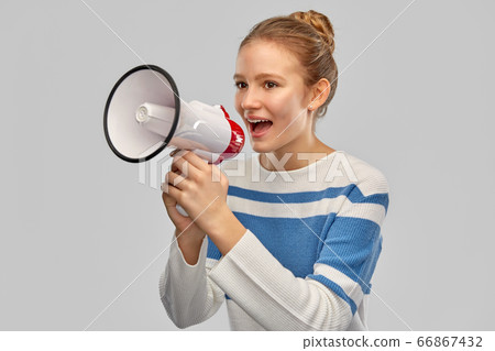 teenage girl speaking to megaphone teenage girl speaking to megaphone 66867432