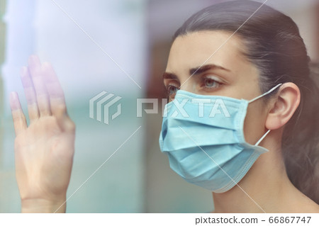 sick young woman wearing protective medical mask sick young woman wearing protective medical mask 66867747