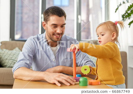 father playing with little baby daughter at home father playing with little baby daughter at home 66867749