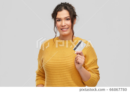 happy smiling young woman with credit card happy smiling young woman with credit card 66867780