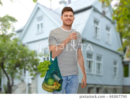 man with food in bag and water in glass bottle man with food in bag and water in glass bottle 66867790
