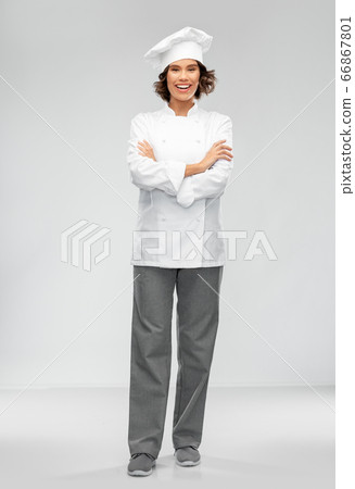 smiling female chef in toque smiling female chef in toque 66867801