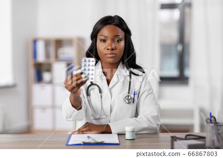 african american doctor with medicine at hospital african american doctor with medicine at hospital 66867803