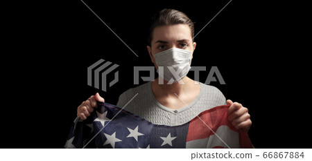 sick woman in face mask holding flag of america sick woman in face mask holding flag of america 66867884