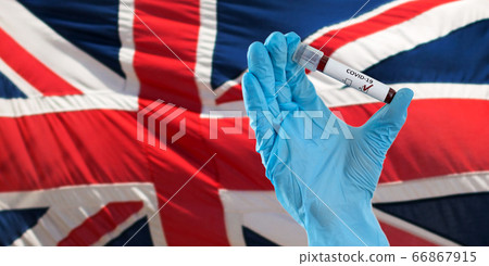 hand holding beaker with coronavirus blood test hand holding beaker with coronavirus blood test 66867915