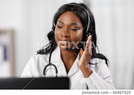 african doctor with headset and laptop at hospital african doctor with headset and laptop at hospital 66867920