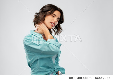young woman in shirt suffering from neck ache young woman in shirt suffering from neck ache 66867928
