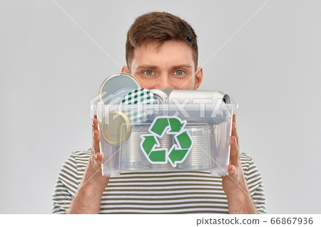 smiling young man sorting metallic waste smiling young man sorting metallic waste 66867936