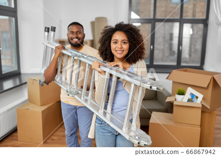 happy couple with ladder moving to new home 66867942