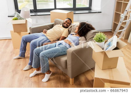 happy couple with boxes moving to new home happy couple with boxes moving to new home 66867943