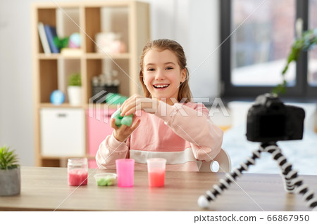 girl with slime and camera video blogging at home girl with slime and camera video blogging at home 66867950