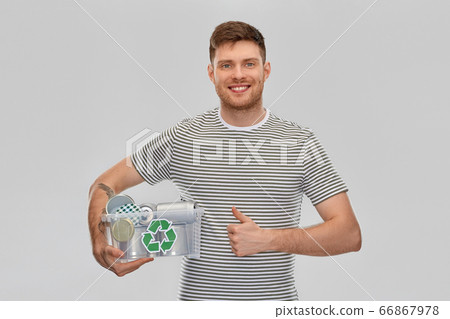 smiling young man sorting metallic waste smiling young man sorting metallic waste 66867978