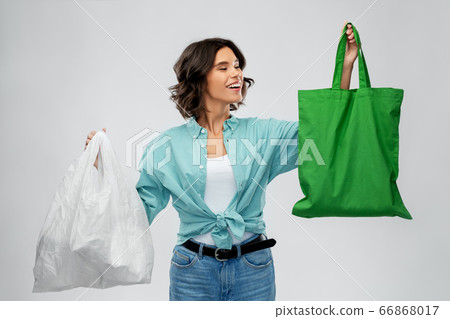 woman with plastic and reusable shopping bag woman with plastic and reusable shopping bag 66868017