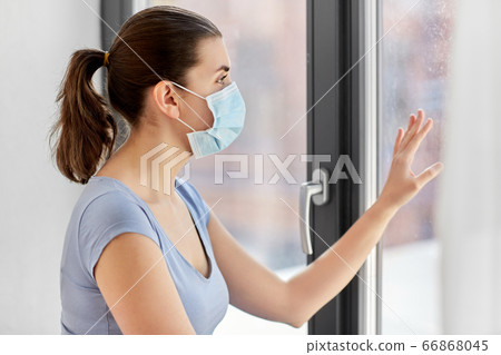 sick young woman wearing protective medical mask sick young woman wearing protective medical mask 66868045