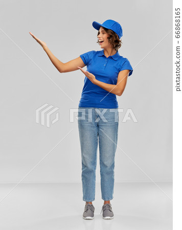 happy smiling delivery woman in blue uniform happy smiling delivery woman in blue uniform 66868165