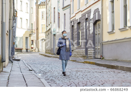 young woman wearing protective medical mask young woman wearing protective medical mask 66868249