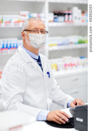 senior apothecary in mask at pharmacy senior apothecary in mask at pharmacy 66868265