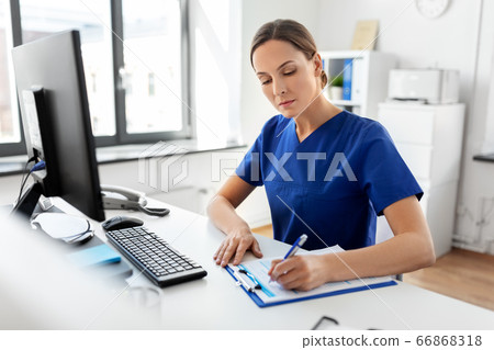 doctor or nurse with clipboard working at hospital 66868318