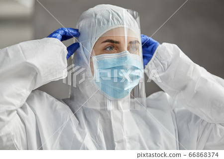 doctor in protective wear, mask and face shield doctor in protective wear, mask and face shield 66868374