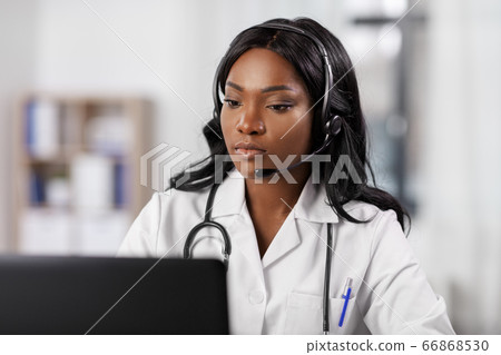 african doctor with headset and laptop at hospital african doctor with headset and laptop at hospital 66868530
